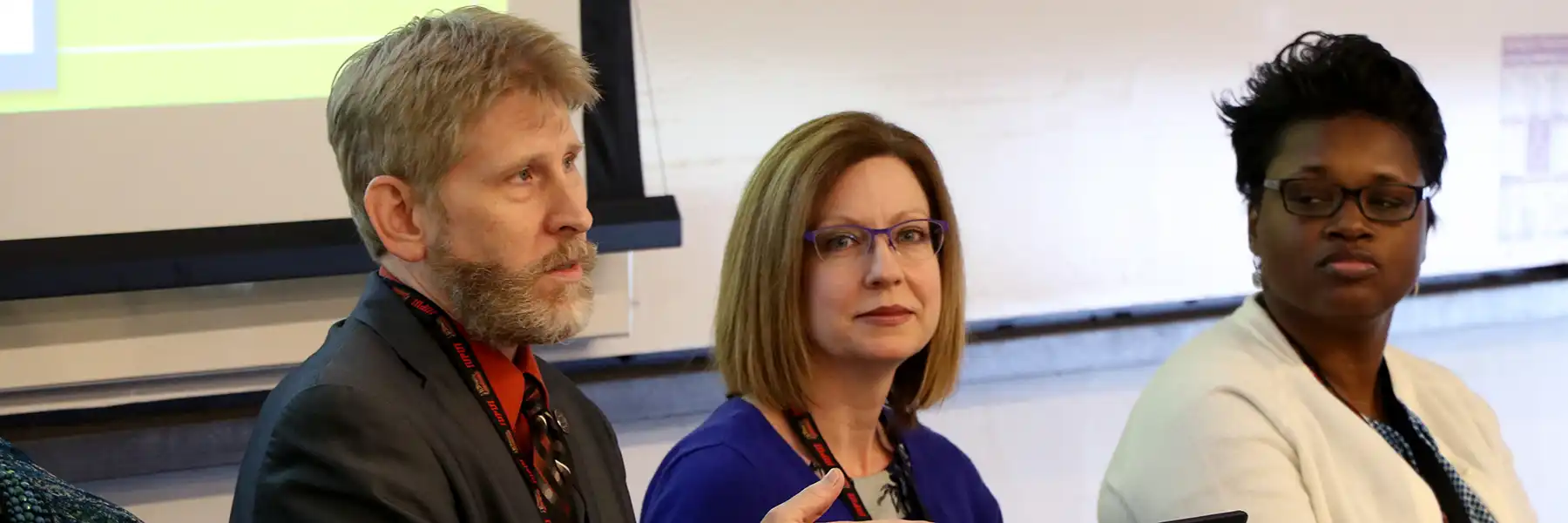 Conference participants in conversation.